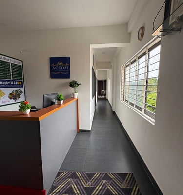 a hallway with a desk and a clock