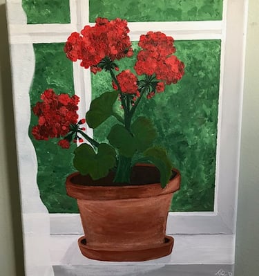 Red Flowers in a Terracotta Clay Pot in Front of a Window
