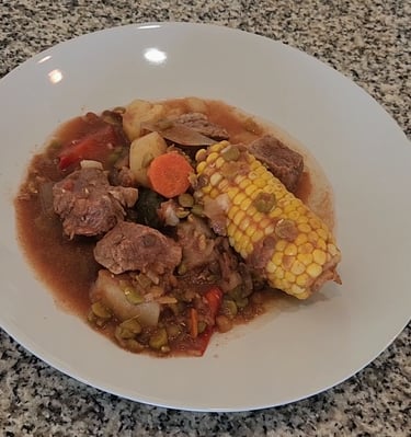 a plate on a counter with casserole meat