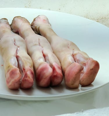 a plate of raw raw trotters