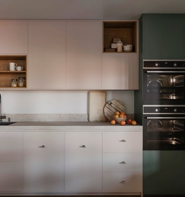 a kitchen with a stove and oven in it