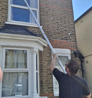 Gutter cleaning a two story house in Hoddesdon
