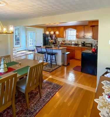 a dining room with a fireplace and a fireplace
