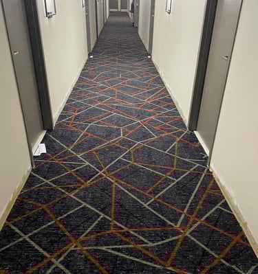 Patterned commercial carpet installed by Master Carpet in the hallway of Holiday Inn