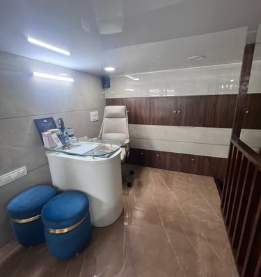 Dr Seema Sheen Aesthetics reception area with a reception table and stools