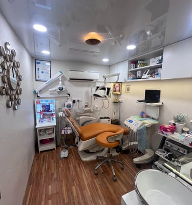 Dr Seema Sheen Aesthetics dental room with a chair and a sink
