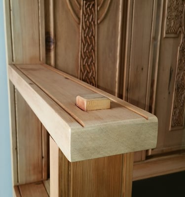 Handmade monks bench arm rest with mortise and tenon joint.  Back panels with carved Celtic Cross. Colorado Springs woodwork.