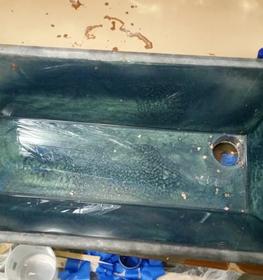 French bath in sea green epoxy, converted to kitchen sink.  Holes cut for faucet and drain. Colorado Springs.
