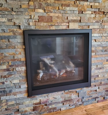 large gas fireplace with stone work surround. Colorado Springs fireplace remodel.