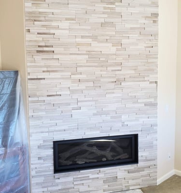 Stone work fireplace surround. recessed lighting. Custom fireplaces in Colorado Springs.