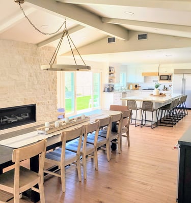 open dining room with stone work fireplace surround and open fully renovated kitchen. Colorado Springs.