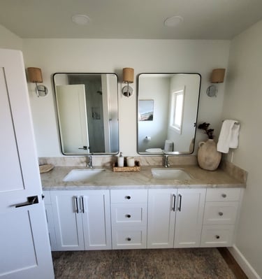 fully renovated bathroom with custom lighting, two sinks, granite counters and custom cabinetry. Colorado Springs.
