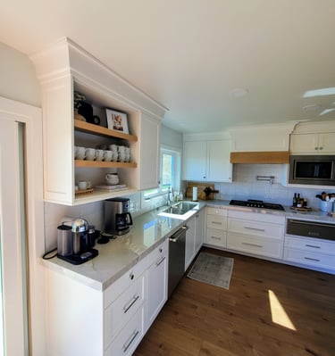 Coffee bar in renovated kitchen. LVP flooring and custom white shaker cabinets. Modern Kitchens Colorado Springs.