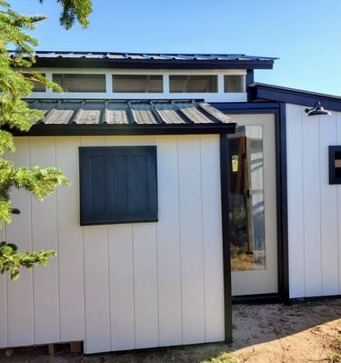 Exterior of custom rabbit barn in El Paso County near Colorado Springs.  removable window panels for increased air flow.