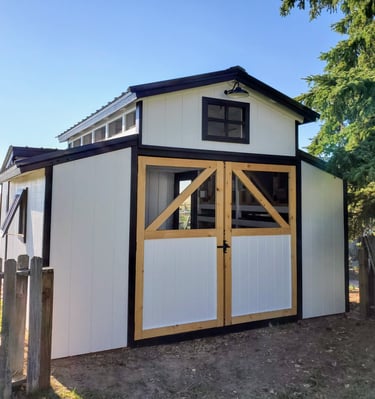 Front of custom rabbit barn with swing open front doors, security light. El Paso County, near Colorado Springs.