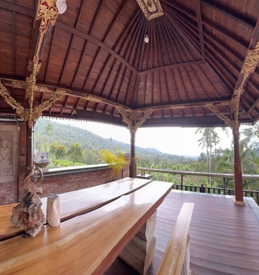 Interior of Joglo house with exposed antique teak beams creating a warm and elegant architectural space