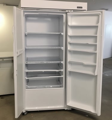 A storefront with large glass windows and multiple signs displaying 'revendo'. Inside, there are visible chairs, plants, and shelves. A poster on the window features the words 'Sell. Repair. Buy.' along with an image of a hand interacting with an electronic device.
