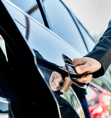a man in a suit and tie is holding a cell phone