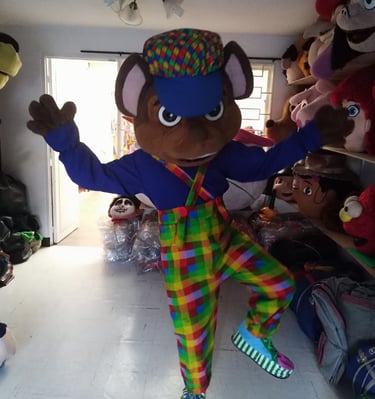 a person in a clown costume standing in a roomS DE PAW PATROL EN GREENVILLE