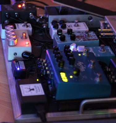 guitar effects on the floor called pedalboard