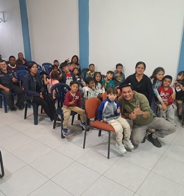 a man sitting in a chair with a group of children