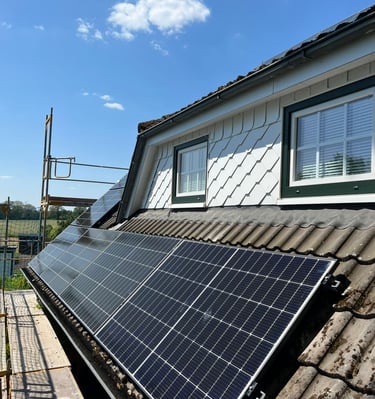 a solar paneled roof with solar panels on a roof