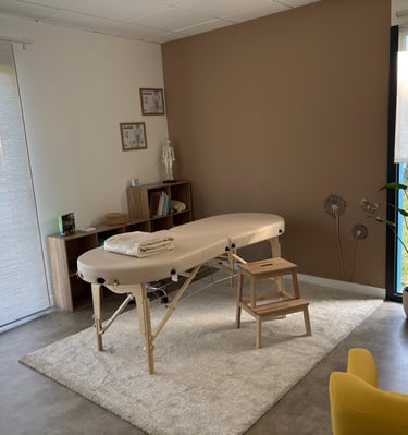 a massage table with a massage table and chairs