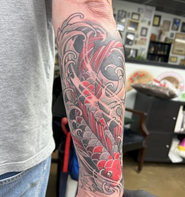 a tattoo on the arm of a man's arm color tattoo koi fish