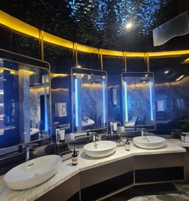 a bathroom with a large mirror and a sink