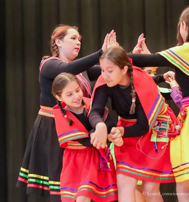 a group of young girls in colorful dresses and colorful clothes