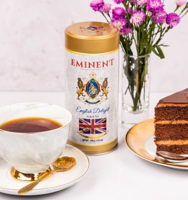 a piece of cake with a cup of coffee and a cup of tea