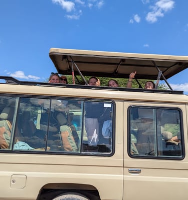 Tourists exploring Tarangire National Park in a safari vehicle on a Tanzania wildlife tour.