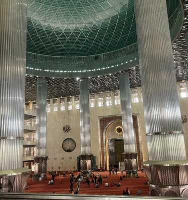 Interior of Istiqlal Mosque in Jakarta, Indonesia, showcasing grand Islamic architecture