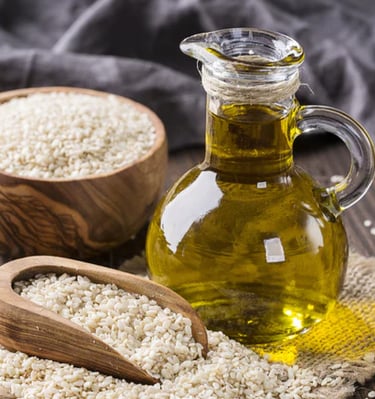 a bottle of rice brans and a wooden spoon with rice