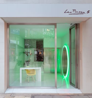 a storefront door with a neon green neon ring