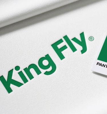 Crisp screen printing of the King Fly logo, showcasing vibrant PMS color matching.