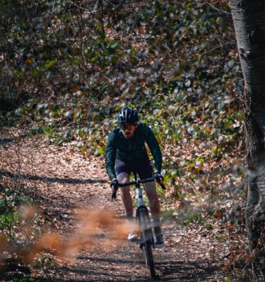 a man riding a bike on a trail