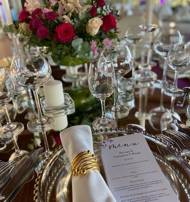 a table setting with a menu card and a menu