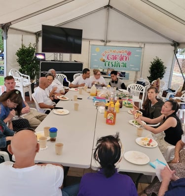 a group of people sitting around a table