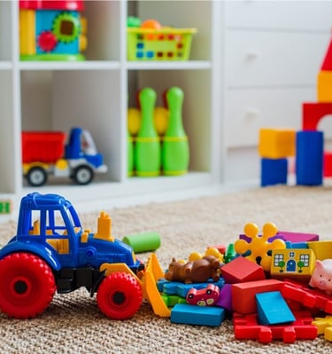 a toy truck with a toy tractor and toys
