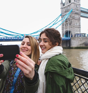 two tourist taking a selfie with a phone
