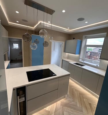 modern kitchen with led lighting and feature ceiling 