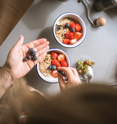 photo of vibrant breakfast fruit bowl being prepared 