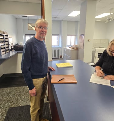 Steven Rugh getting his petition checked in at the County Office
