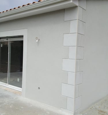 a house with a large window and a patio with a patio