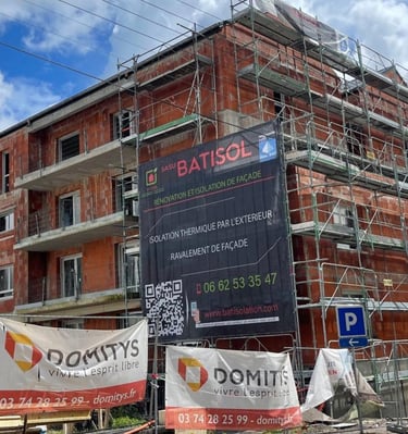 a building with scaffiered signs on it