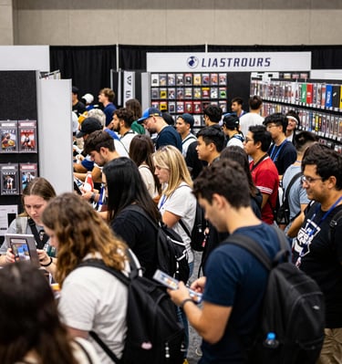 Wide shot of the Pal Parsippany venue showing rows of tables and enthusiastic attendees.