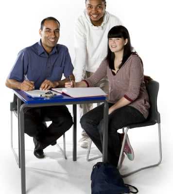 Image of three adults that are studying
