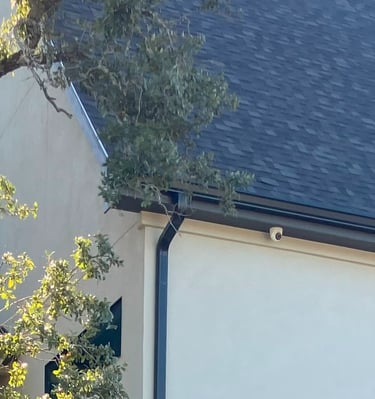 turret camera installed on eave of home