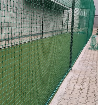 Close-up of a sturdy balcony safety net installed to keep pigeons away.